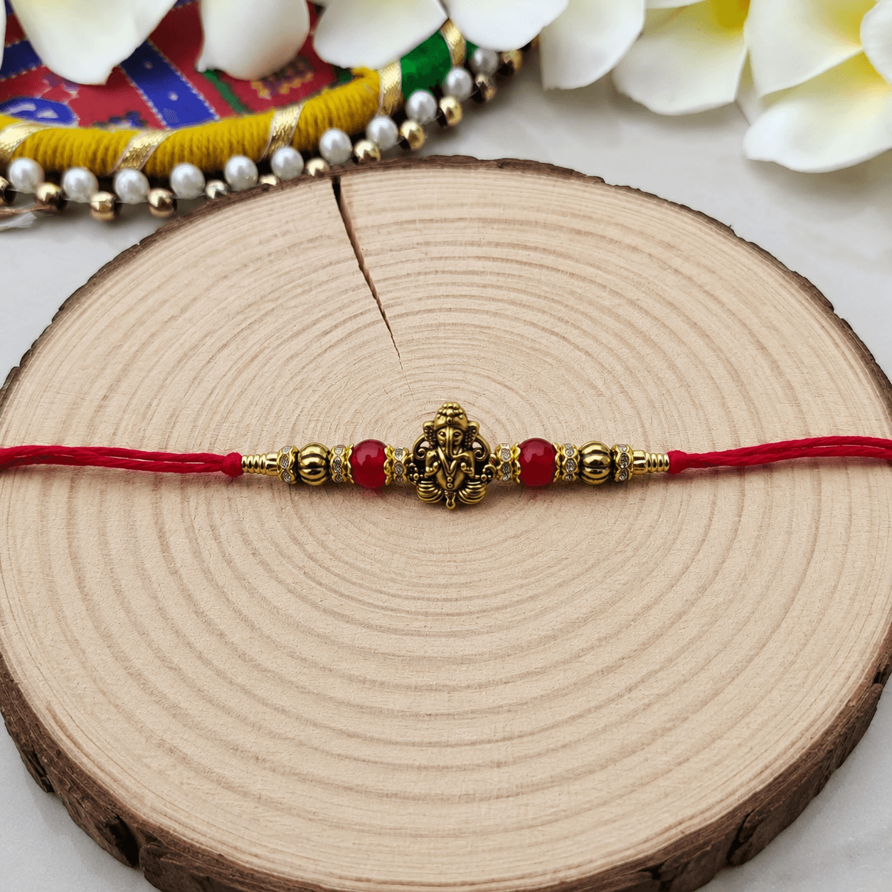 Divine Ganesha Rakhi Set (2pcs)